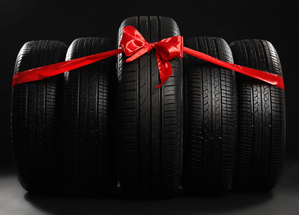 New car tires tied with ribbon