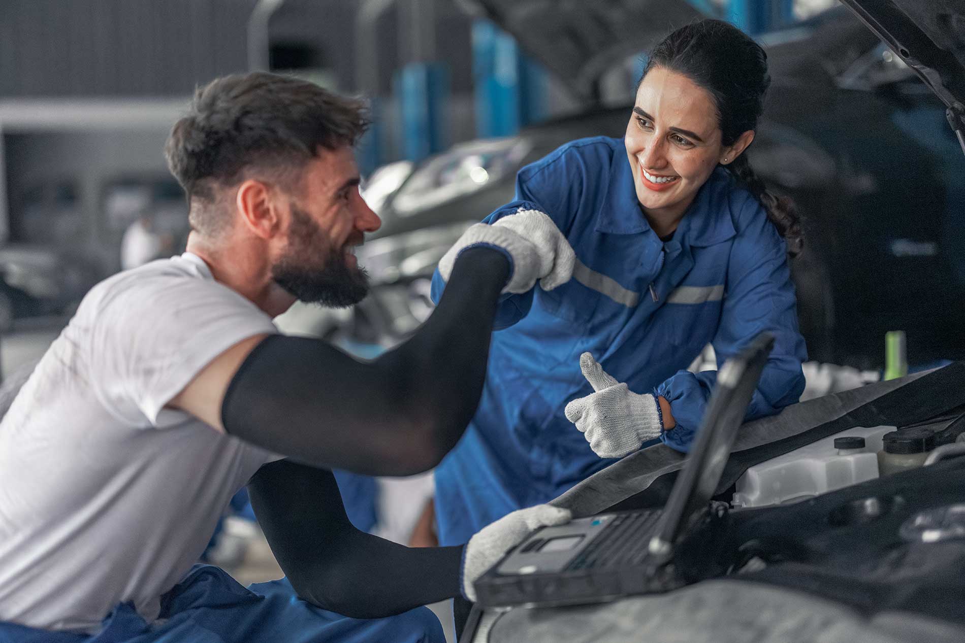 Car-technician-use-computerized-diagnostic-to-analyze Car-technician-use-computerized-diagnostic-to-analyze