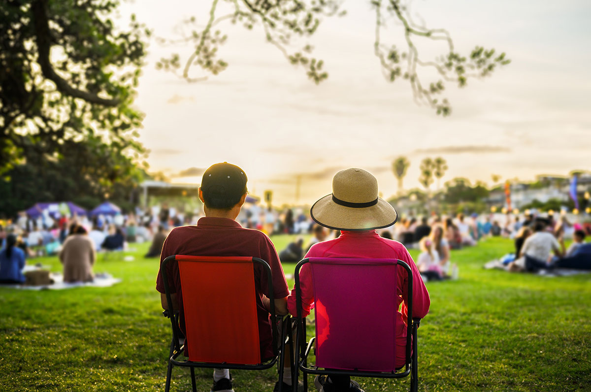 Couple sitting on the picnic chairs