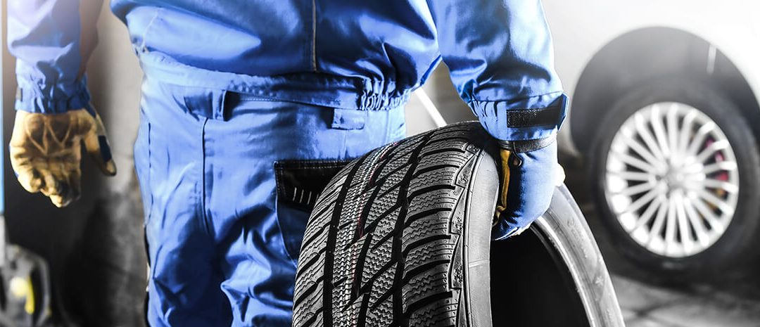 Mechanic holding tire