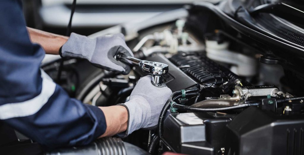 mechanic-repairing-an-engine mechanic-repairing-an-engine